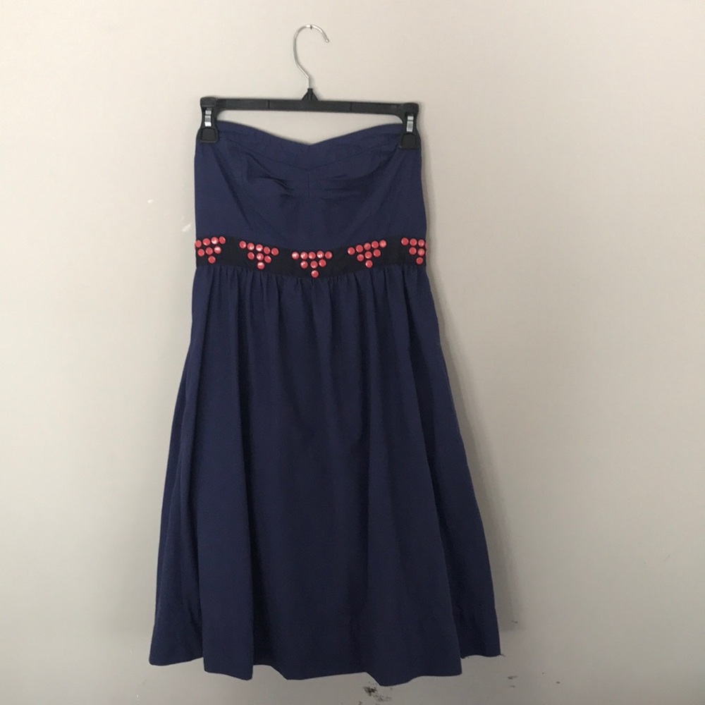 Navy blue strapless dress with pink patterned belt